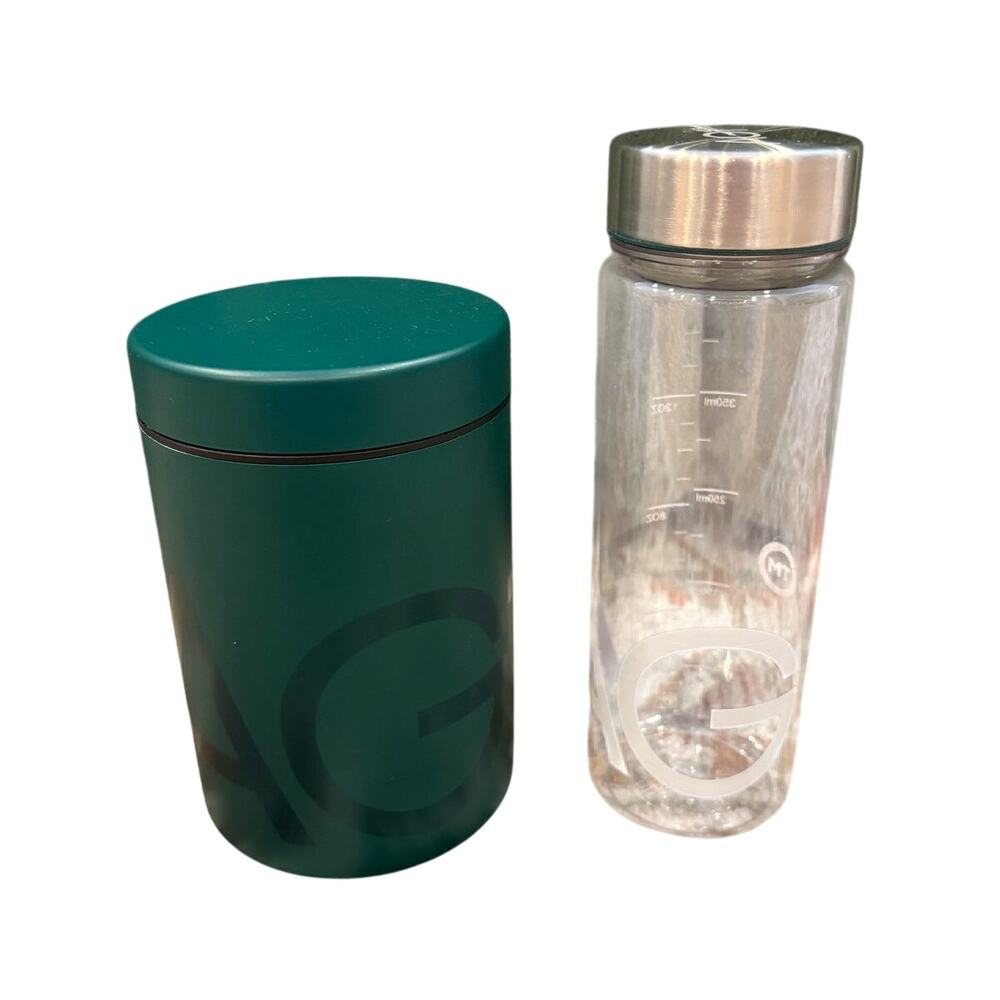 AG1 clear water bottle, green canister and metal scoop